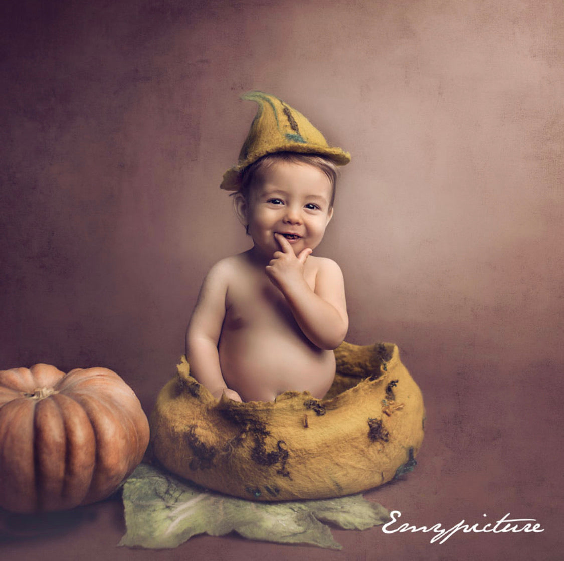 Handmade mustard felted bowl used in an autumn sitter photography setup