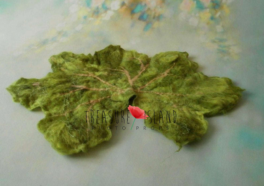 Handmade green felted autumn leaf with detailed wool veining for photography setups