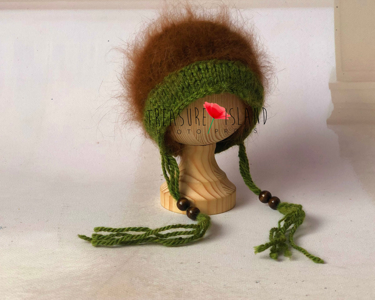 Green and brown hand-knitted forest bonnet with decorative wooden beads for newborn and sitter photography