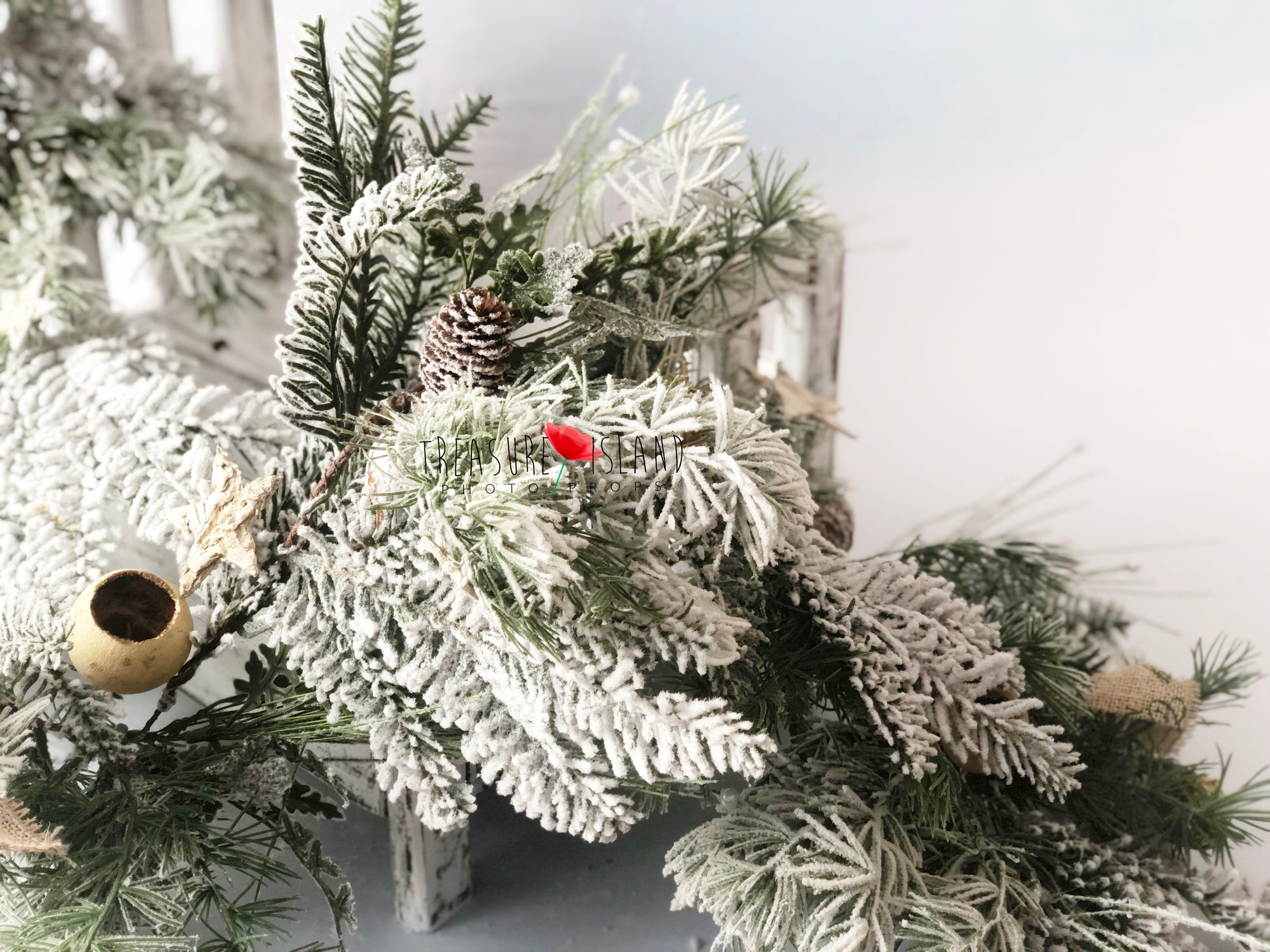 Rich frosted evergreen Christmas garland with snowy branches and pinecones for winter photography