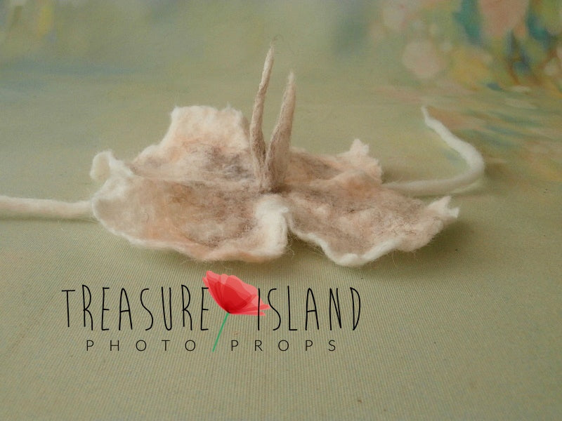Handmade felted flower baby headband with softly sculpted wool petals for photography styling