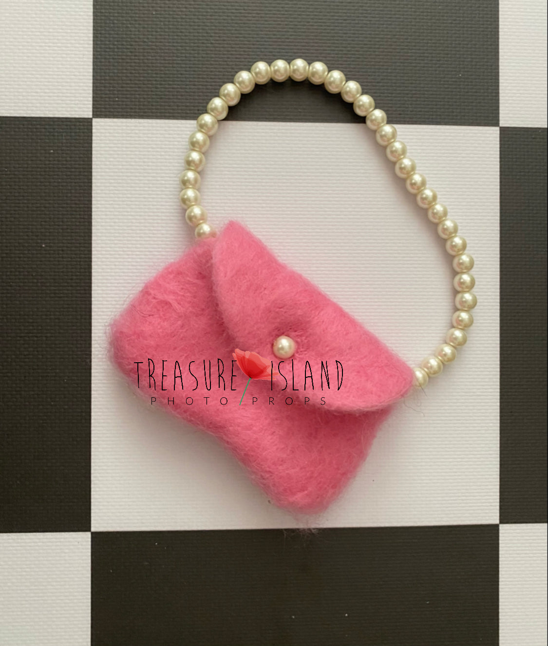 Handmade miniature pink doll handbag created as a small photography styling prop