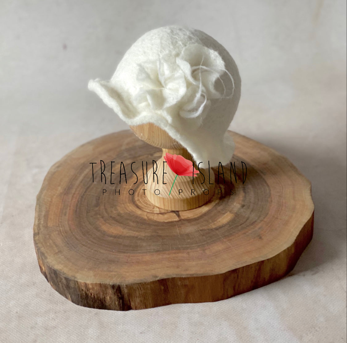 Handmade white felted bonnet with sculpted wool flower for newborn photography