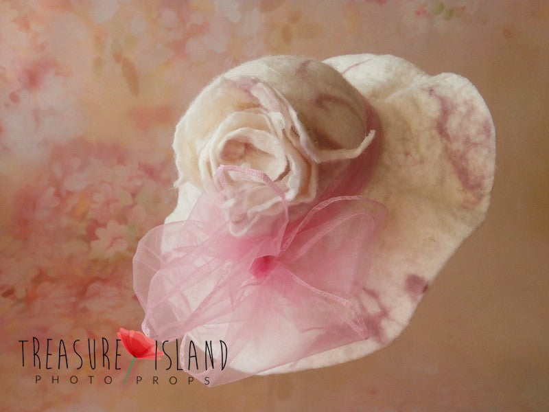 Close-up of Rosalie Blush felted wool hat with statement flower and soft pink organza bow